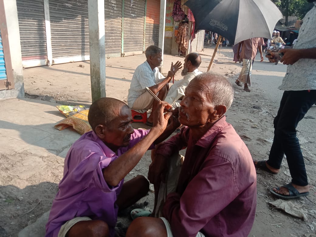 The tradition of cutting hair and beards sitting on the ground is disappearing